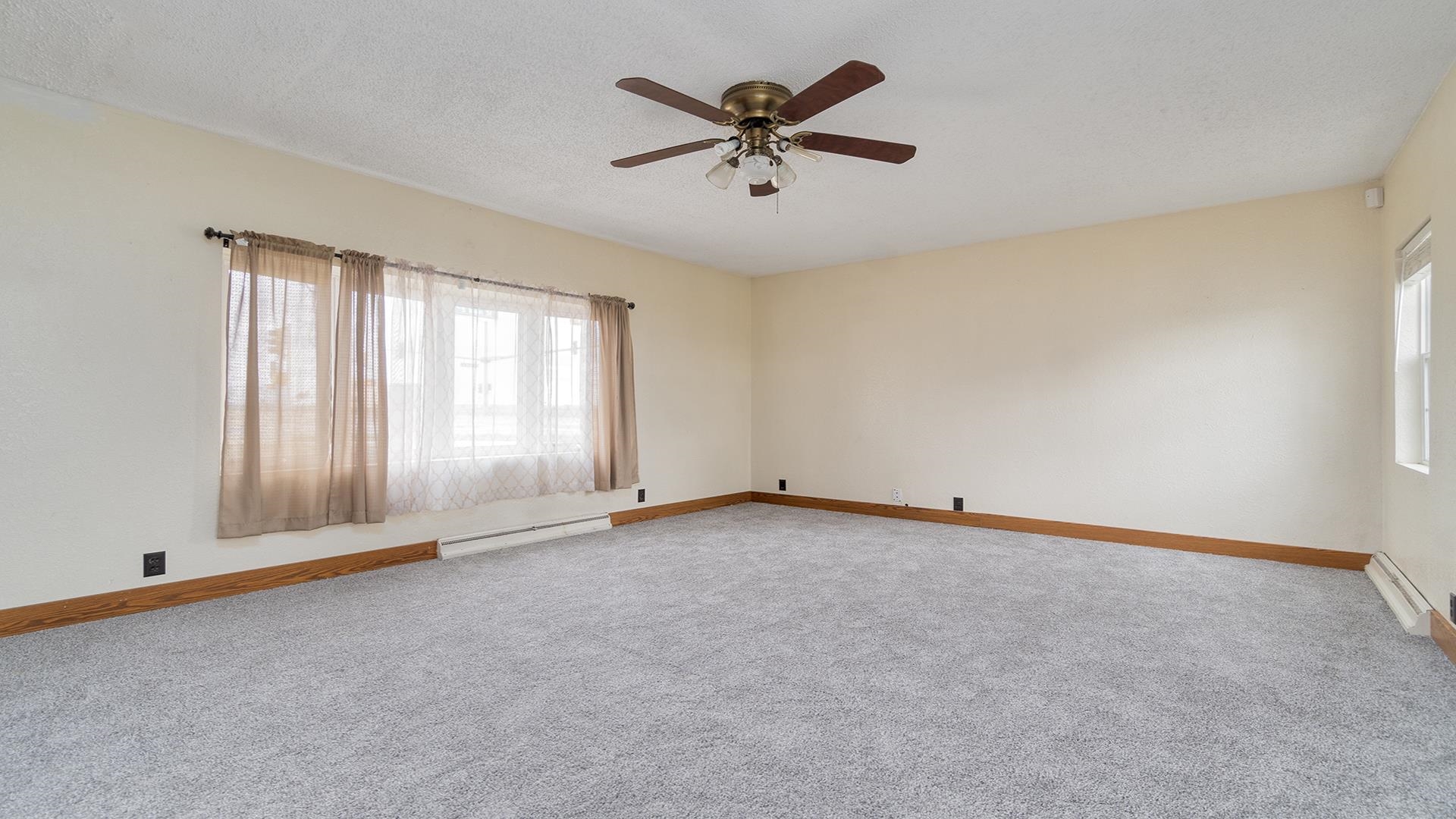 8446 South Main Street Rochelle, IL 61068 - Photo 16 of 29 an empty room with fan and windows