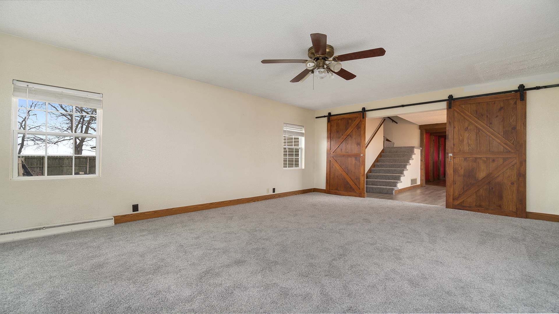 8446 South Main Street Rochelle, IL 61068 - Photo 17 of 29 a view of an empty room with a window
