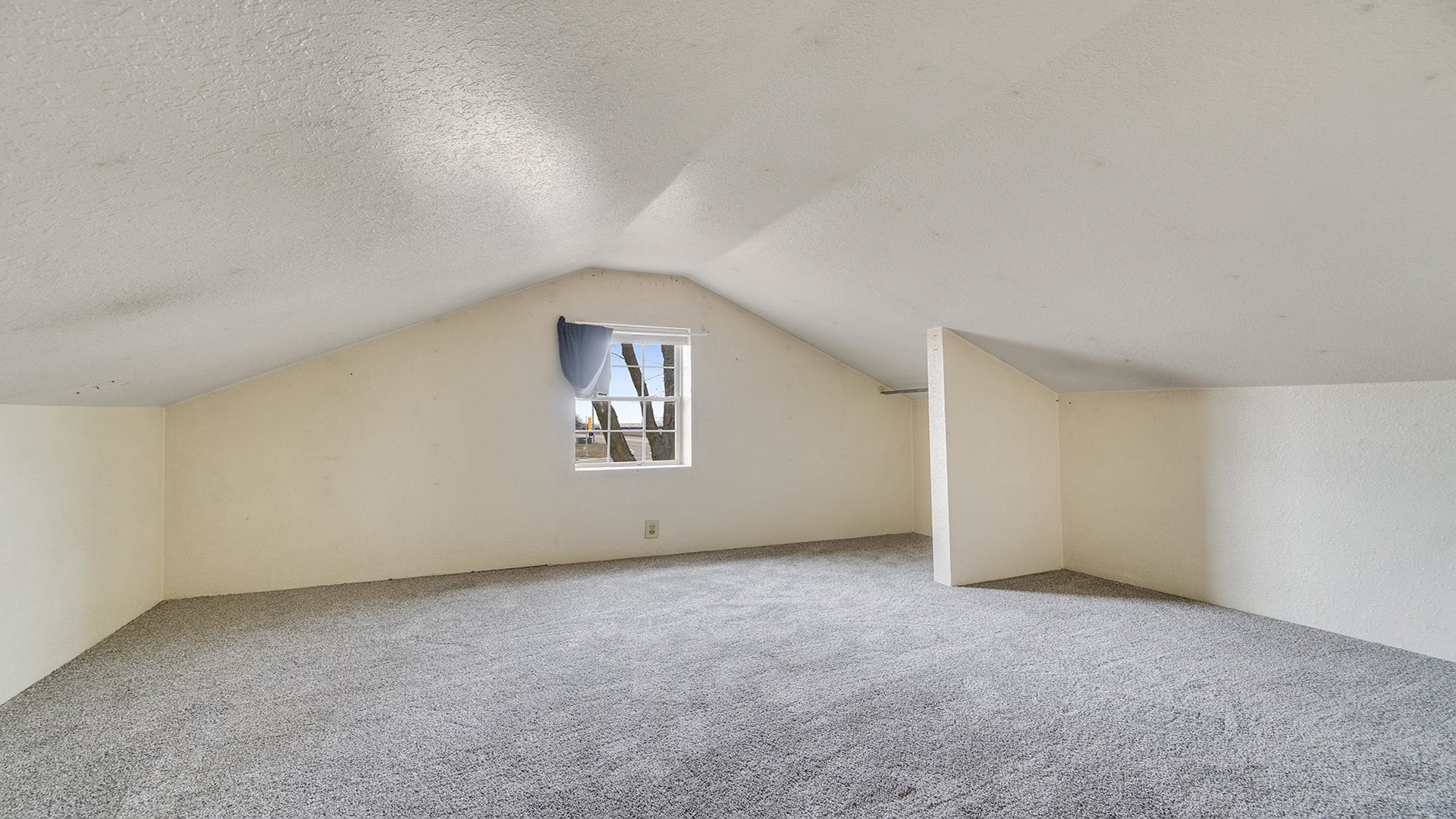 8446 South Main Street Rochelle, IL 61068 - Photo 20 of 29 a view of an empty room with a window