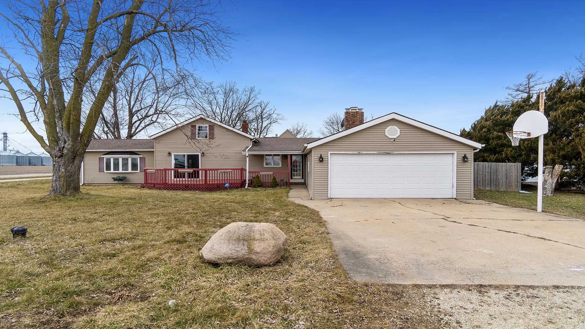 8446 South Main Street Rochelle, IL 61068 - Photo 28 of 29 a view of a white house with a yard and large tree
