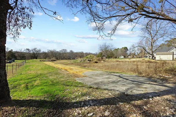 a view of a lake with a yard