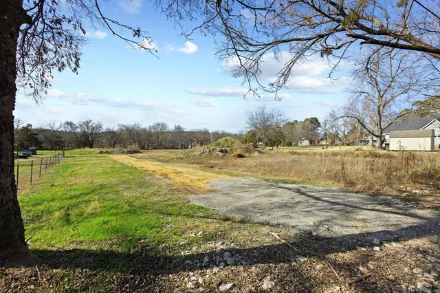a view of a lake with a yard