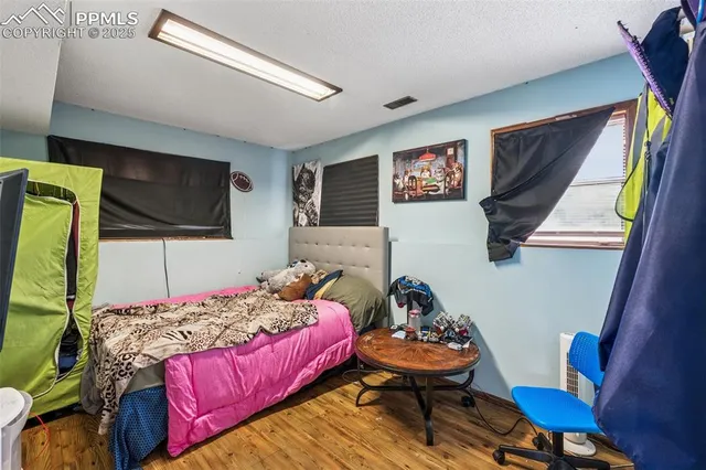 a bedroom with a bed and furniture