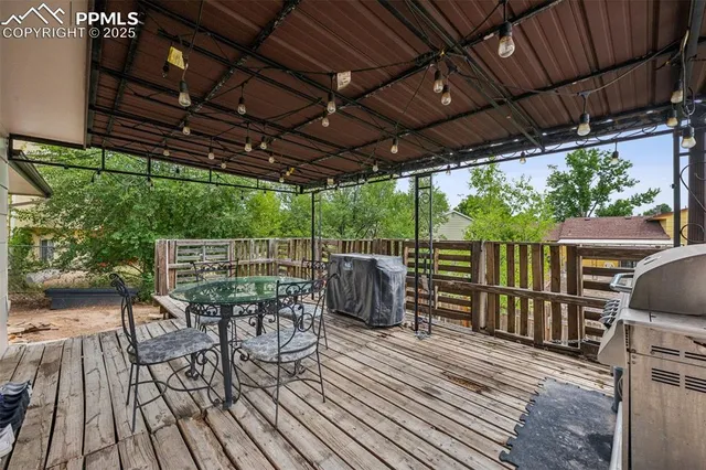 a view of a chairs and table on the wooden floor