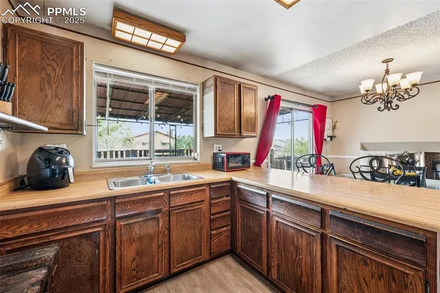 a kitchen with a sink and a window