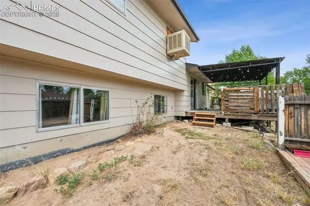 a view of a house with a bed and chair