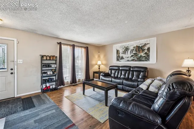a reading room with furniture and wooden floor