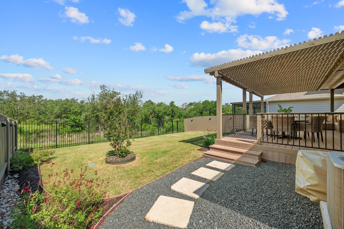 a view of a backyard with sitting area
