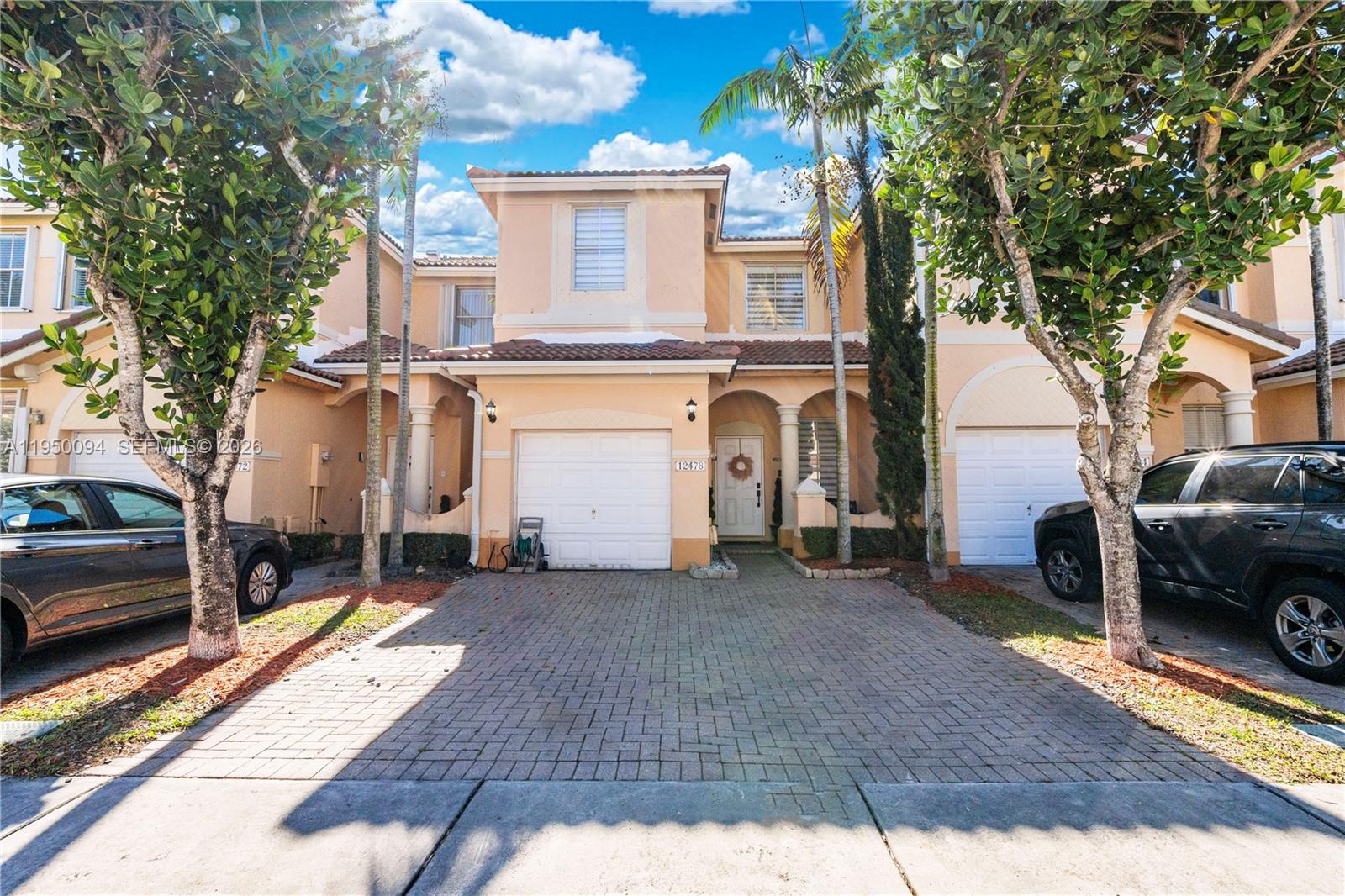 a view of a car park in front of a house