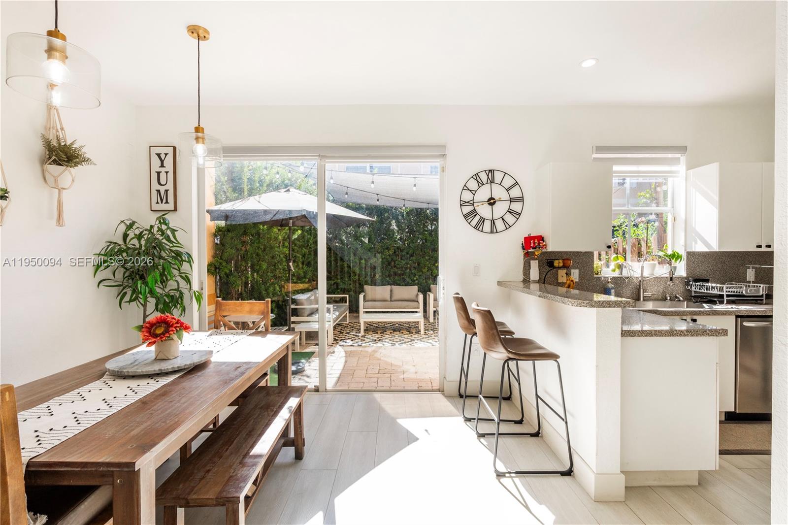 12478 Southwest 123rd Street Miami, FL 33186 - Photo 11 of 34 a very nice looking dining room with a large window and dining table