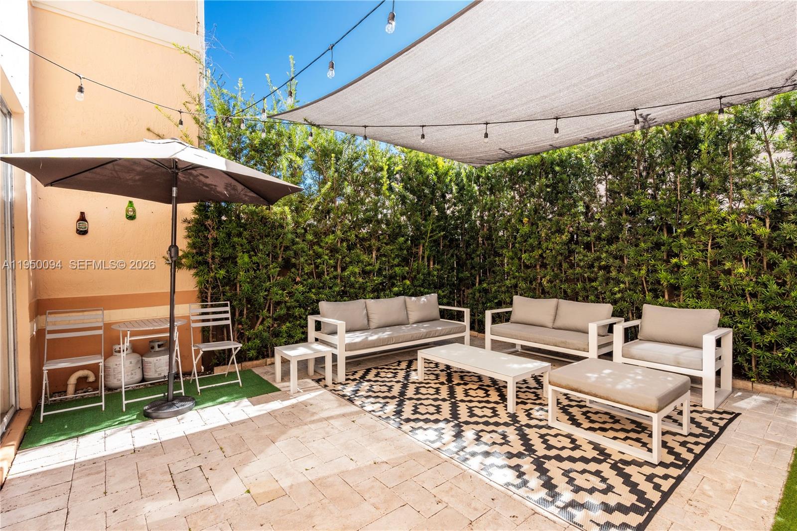 12478 Southwest 123rd Street Miami, FL 33186 - Photo 14 of 34 an outdoor space with patio