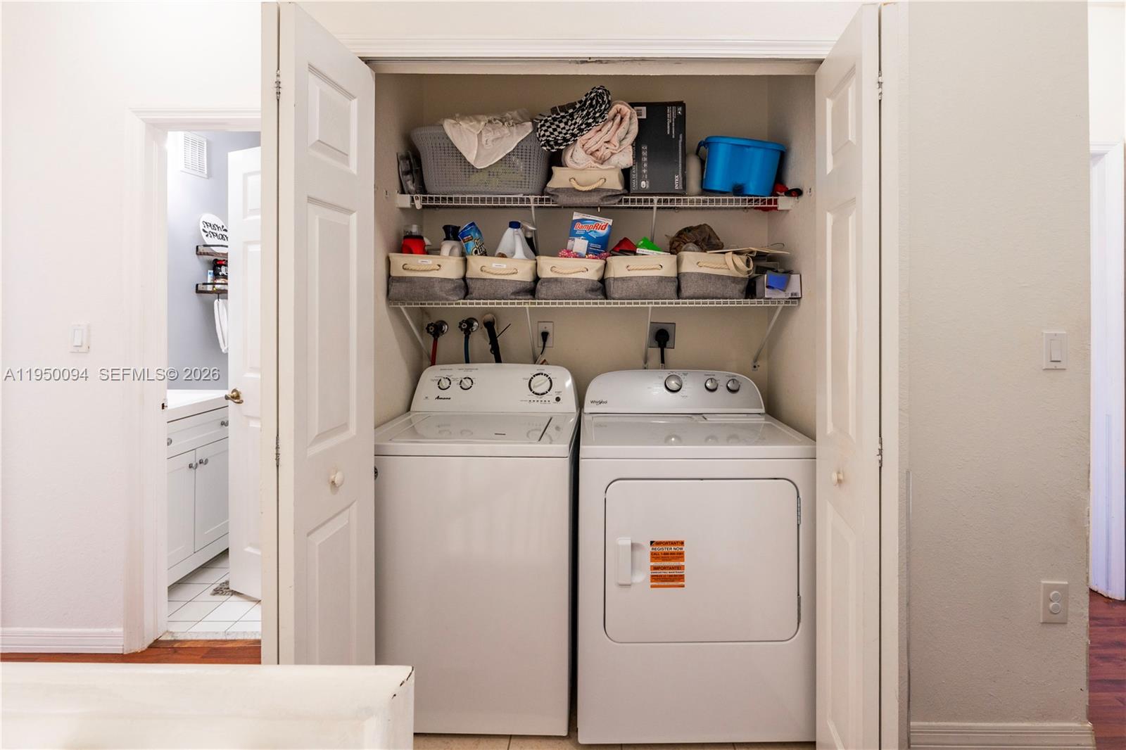 12478 Southwest 123rd Street Miami, FL 33186 - Photo 20 of 34 a utility room with dryer and washer