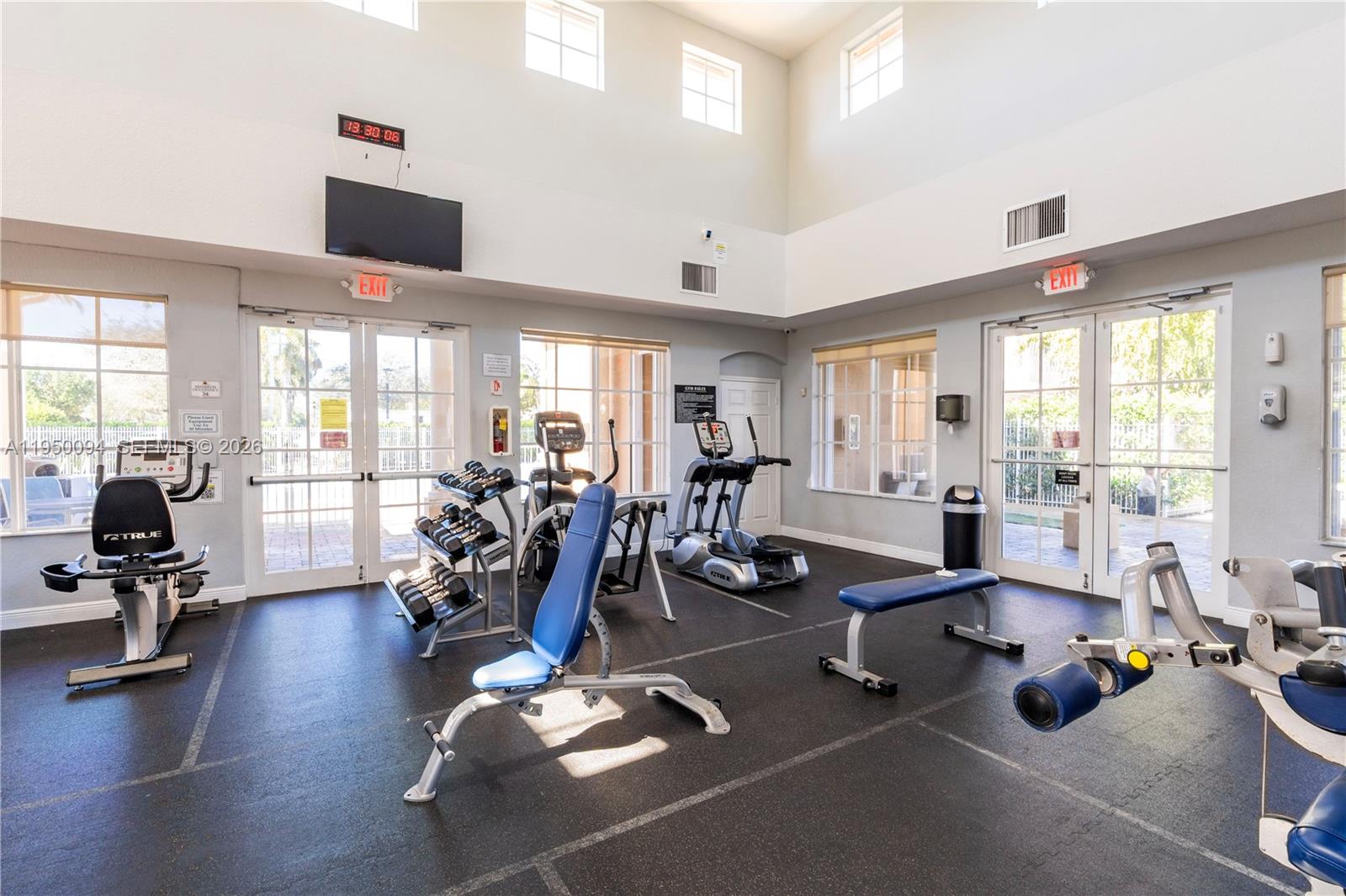 12478 Southwest 123rd Street Miami, FL 33186 - Photo 27 of 34 a room with gym equipment and a large window