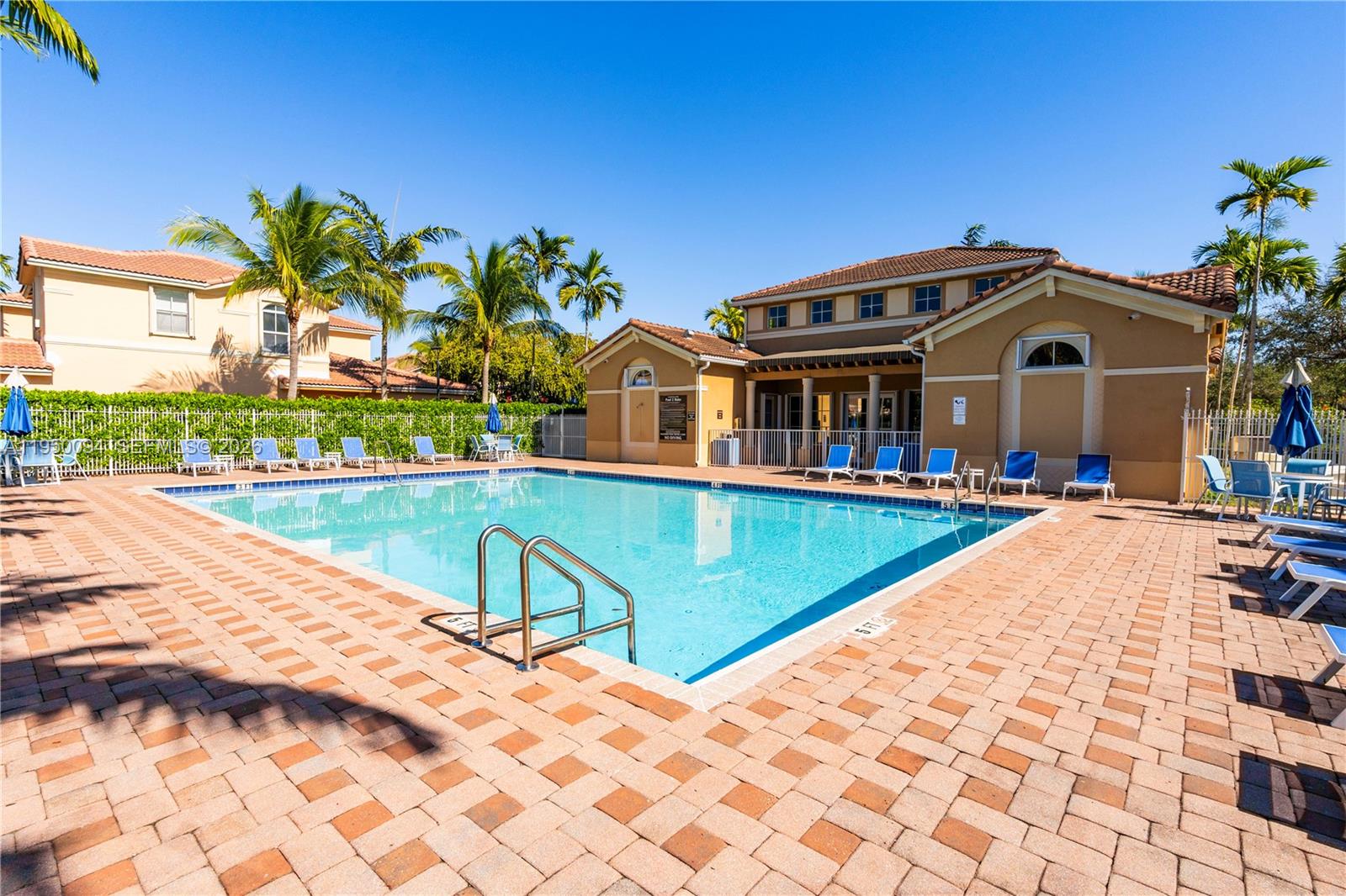 12478 Southwest 123rd Street Miami, FL 33186 - Photo 30 of 34 a front view of a house with swimming pool