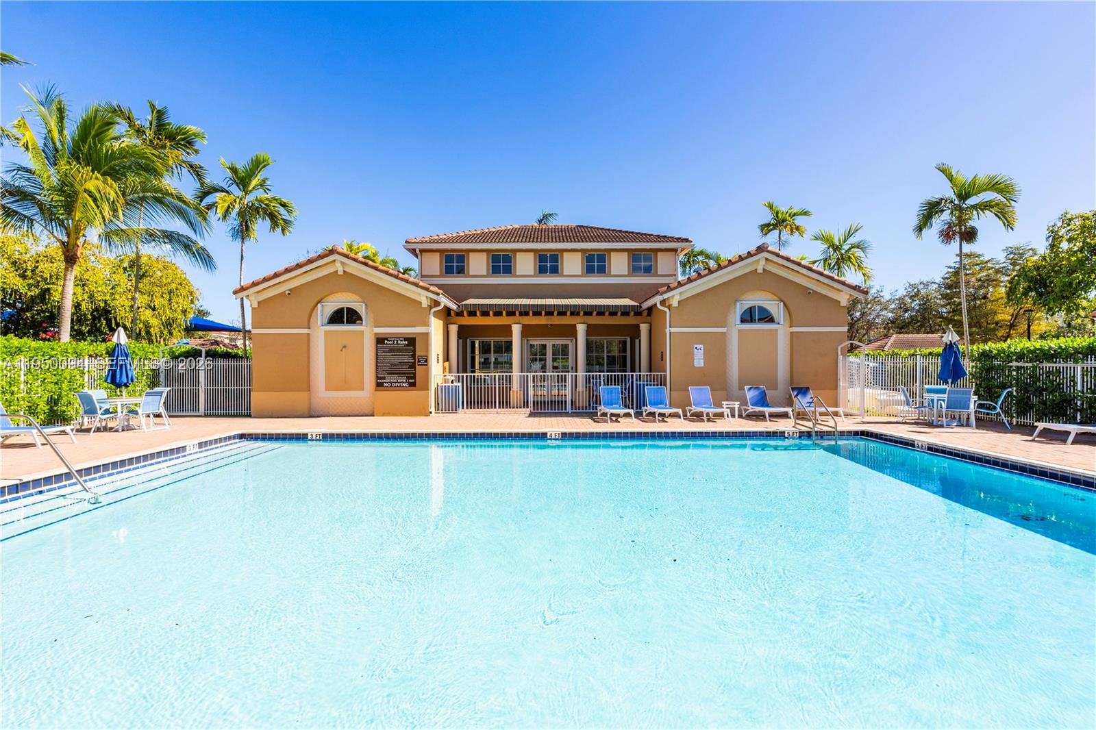 12478 Southwest 123rd Street Miami, FL 33186 - Photo 31 of 34 a front view of a house with swimming pool