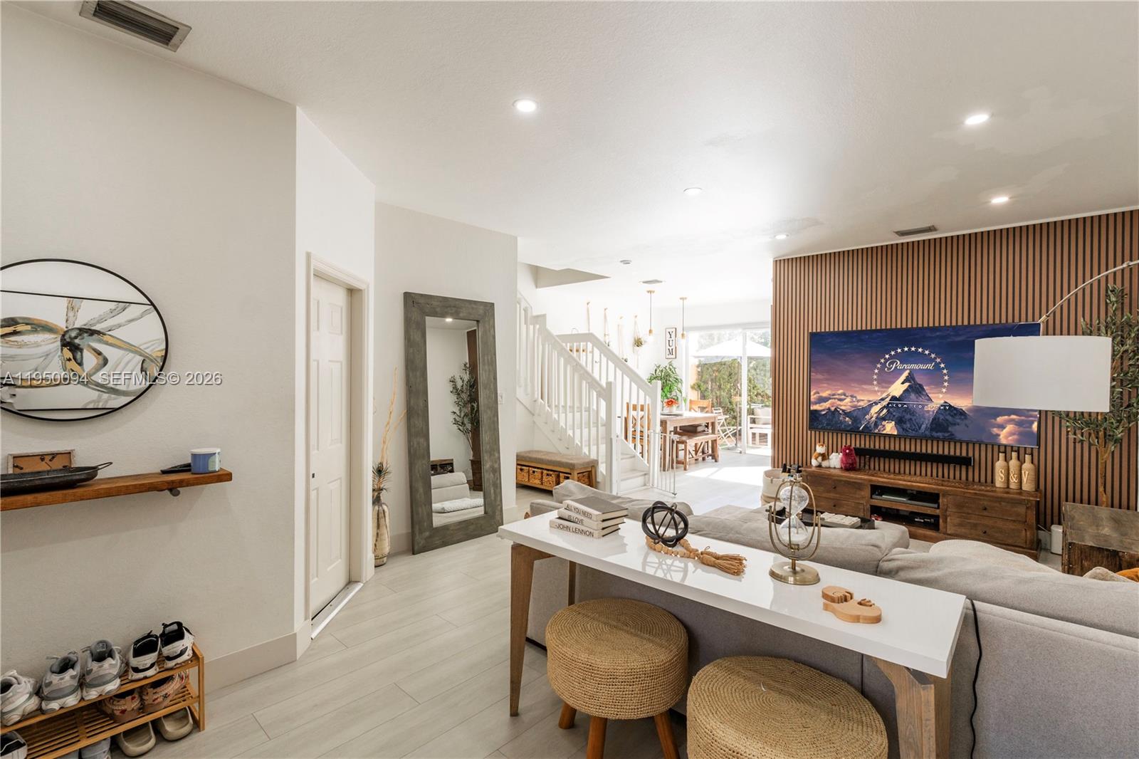 12478 Southwest 123rd Street Miami, FL 33186 - Photo 4 of 34 a room with furniture a rug kitchen view and a window