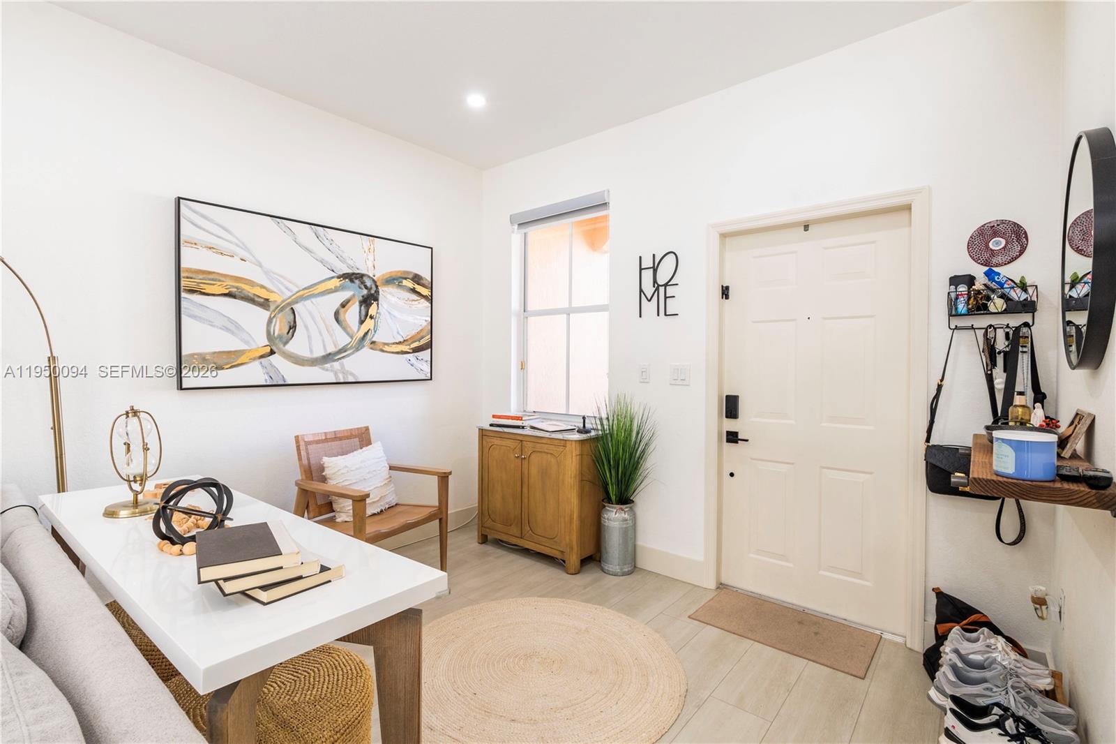 12478 Southwest 123rd Street Miami, FL 33186 - Photo 6 of 34 a view of a workspace with furniture and gym equipment