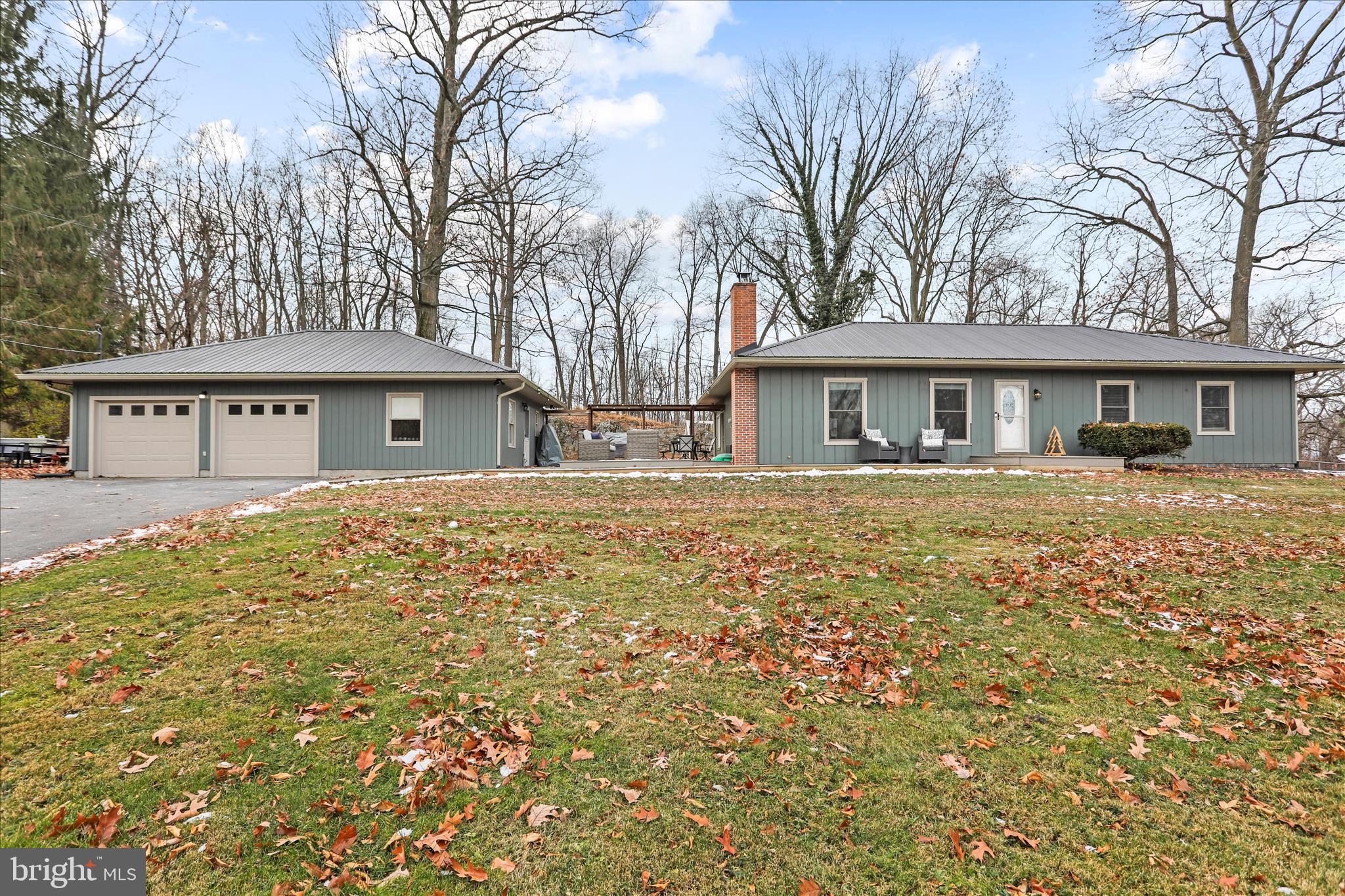 7879 Talhelm Road Chambersburg, PA 17202 - Photo 1 of 43 a front view of a house with a garden