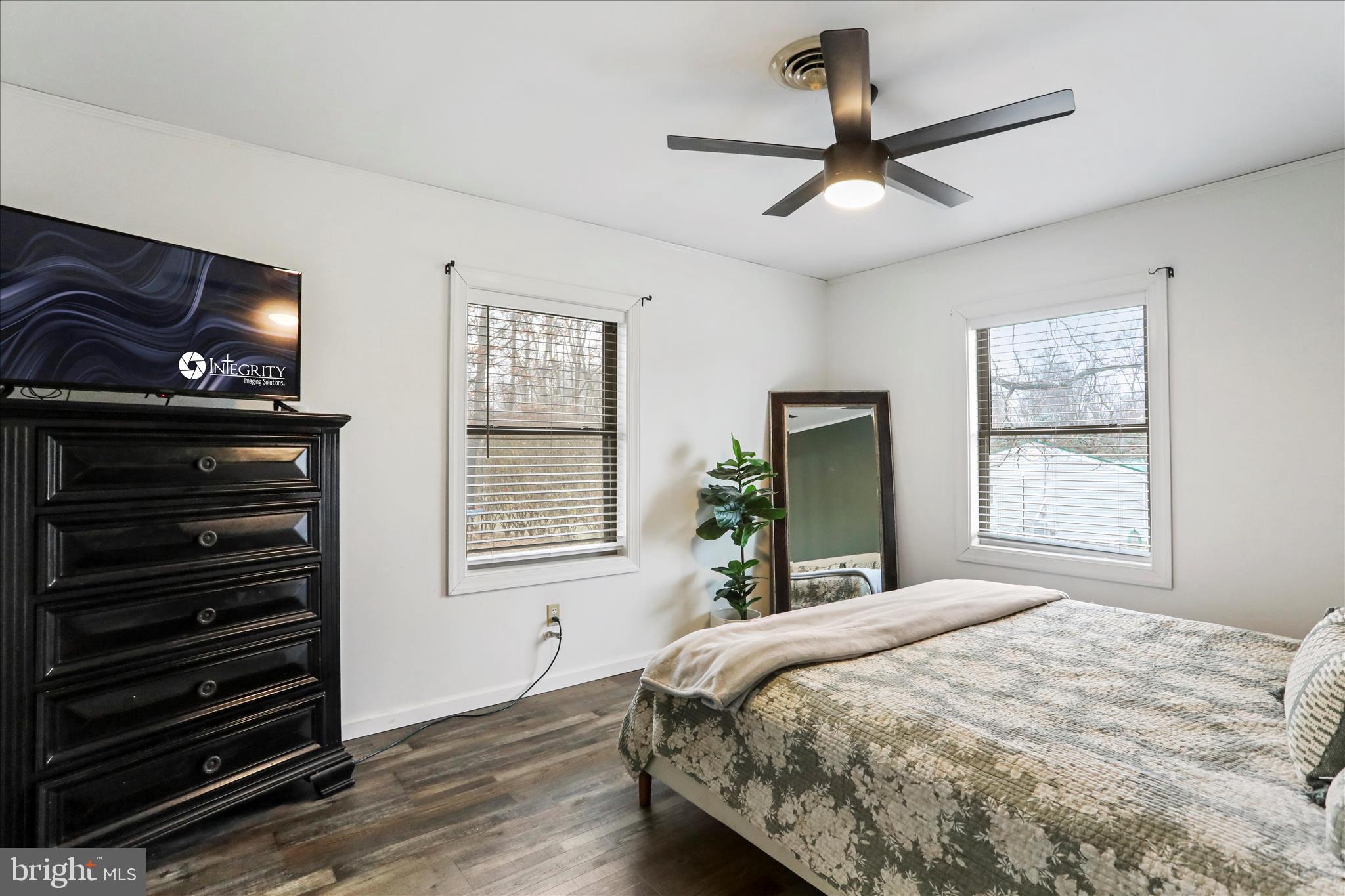 7879 Talhelm Road Chambersburg, PA 17202 - Photo 12 of 43 a bedroom with a bed and a ceiling fan