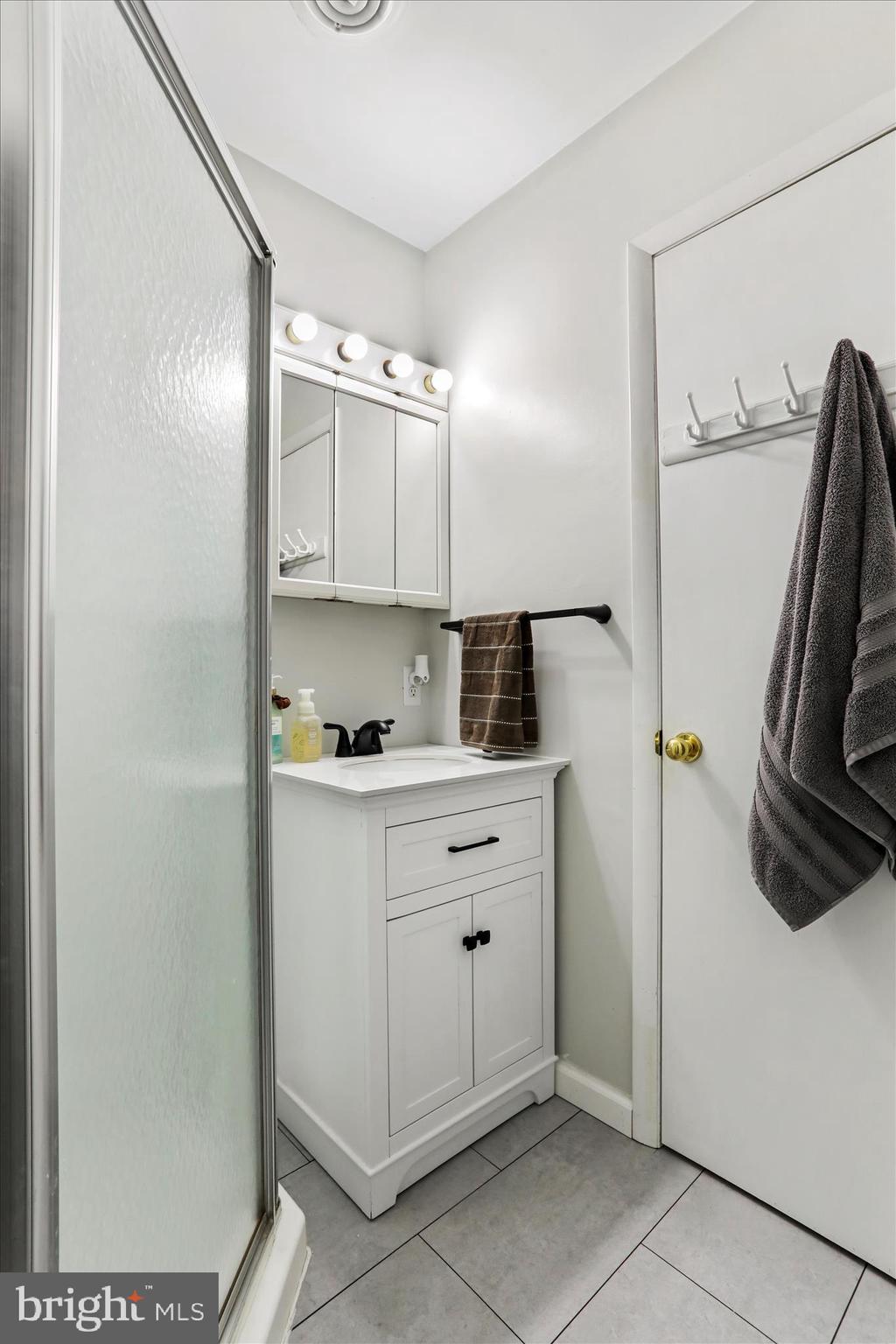 7879 Talhelm Road Chambersburg, PA 17202 - Photo 16 of 43 a kitchen with a refrigerator and cabinets