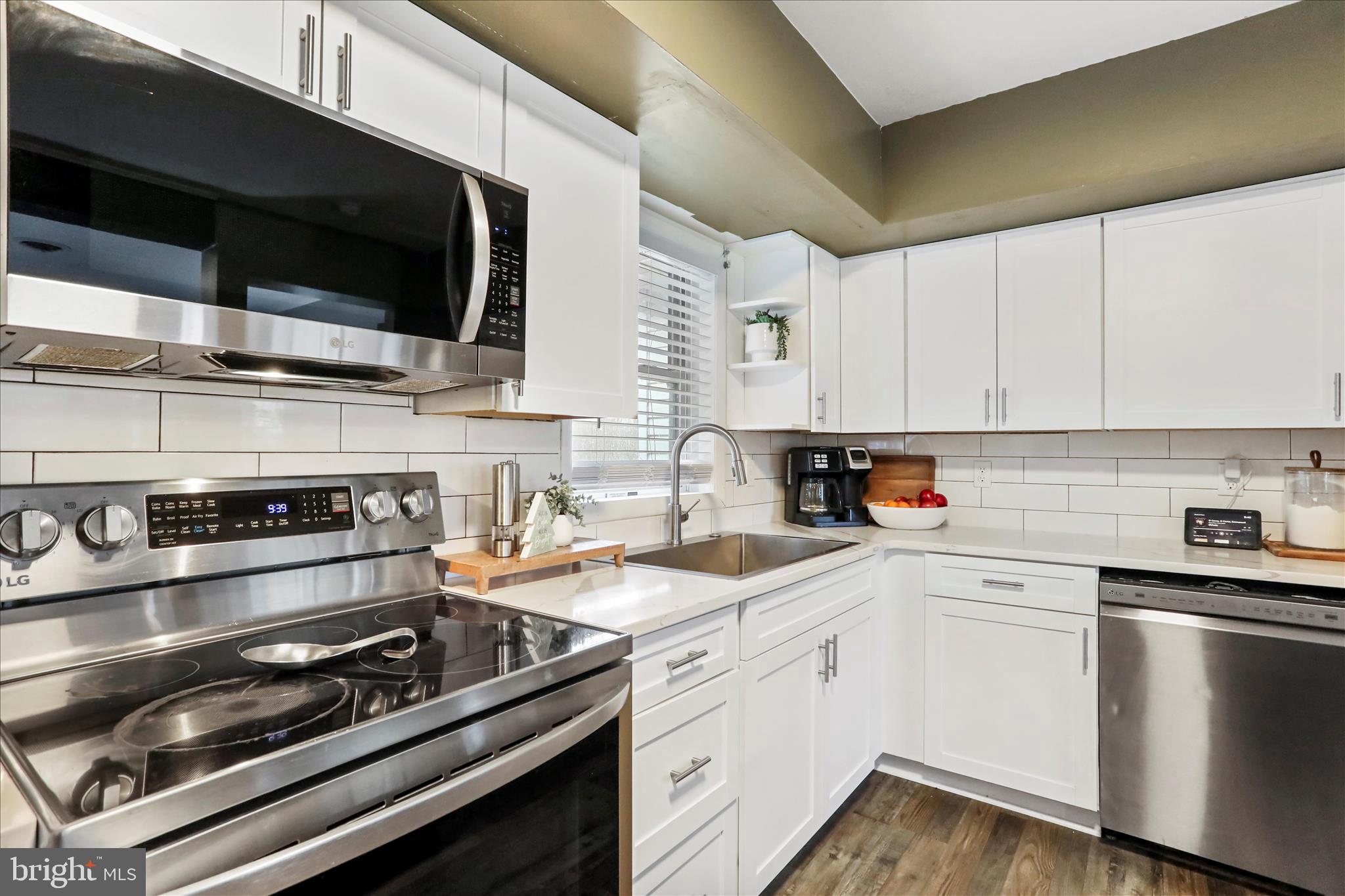 7879 Talhelm Road Chambersburg, PA 17202 - Photo 22 of 43 a kitchen with a stove and a microwave