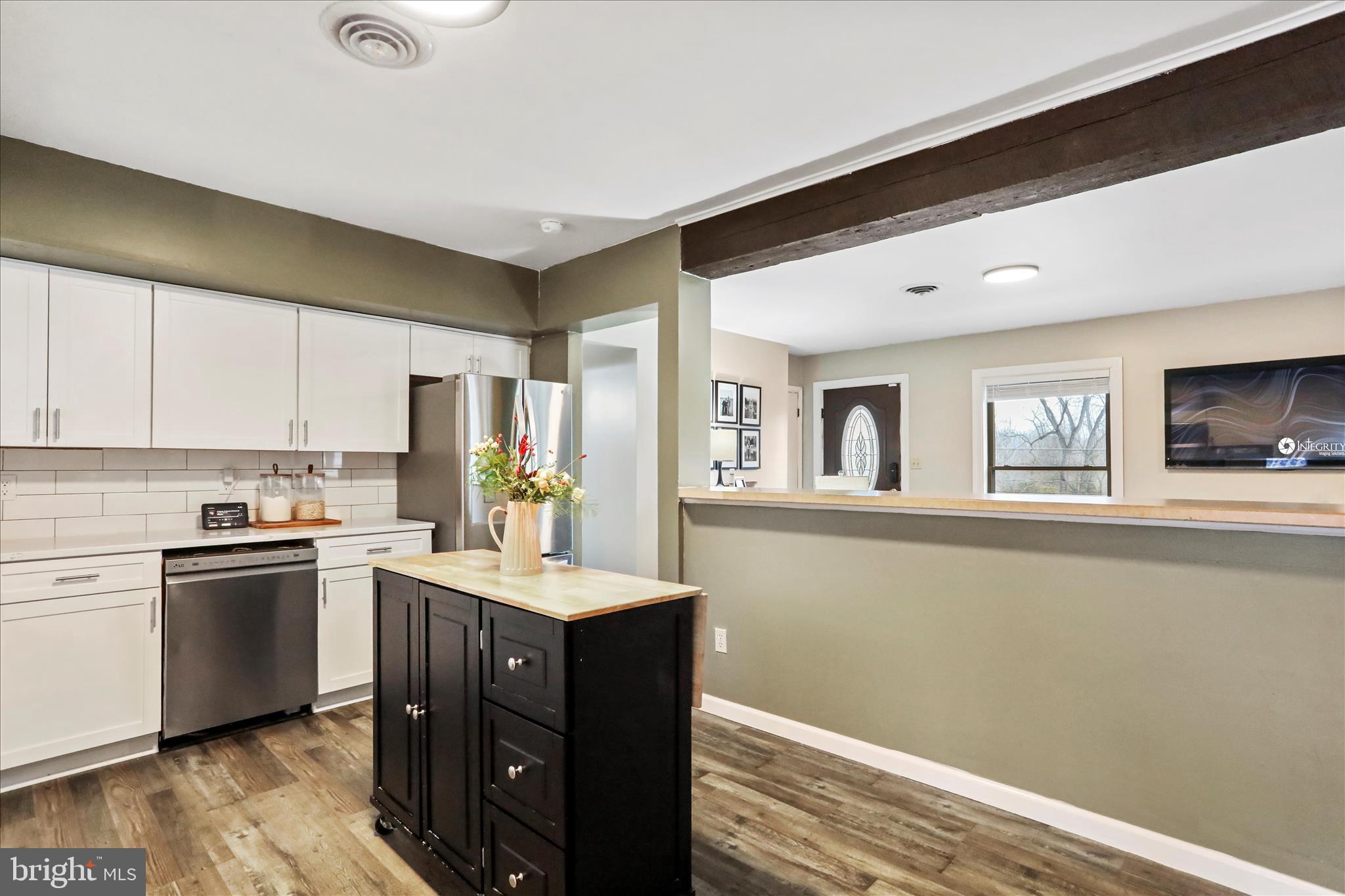 7879 Talhelm Road Chambersburg, PA 17202 - Photo 23 of 43 a kitchen with a sink stove and cabinets