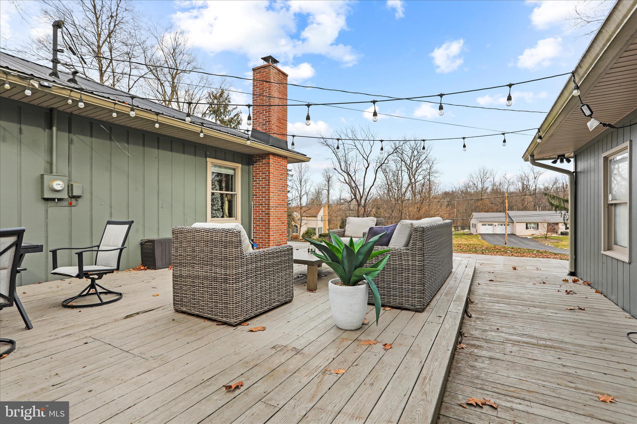 7879 Talhelm Road Chambersburg, PA 17202 - Photo 29 of 43 a balcony with furniture and a wooden floor