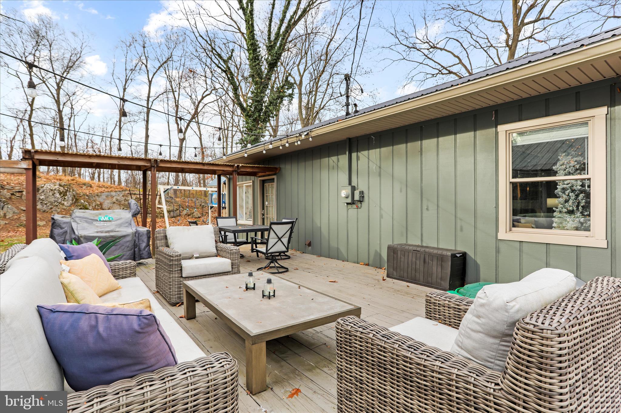 7879 Talhelm Road Chambersburg, PA 17202 - Photo 30 of 43 a balcony view with a couch and wooden floor