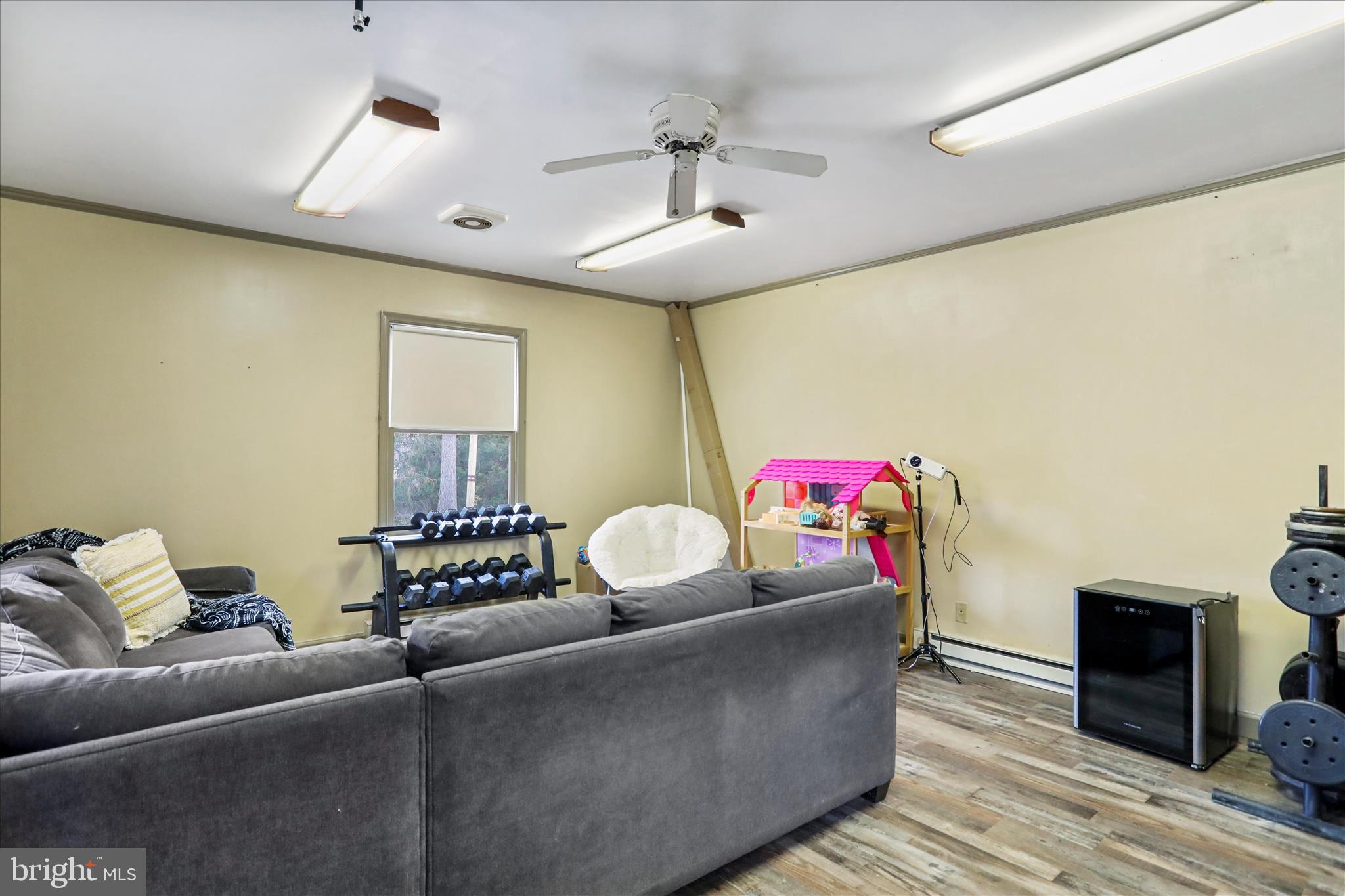 7879 Talhelm Road Chambersburg, PA 17202 - Photo 31 of 43 a living room with furniture and a chandelier