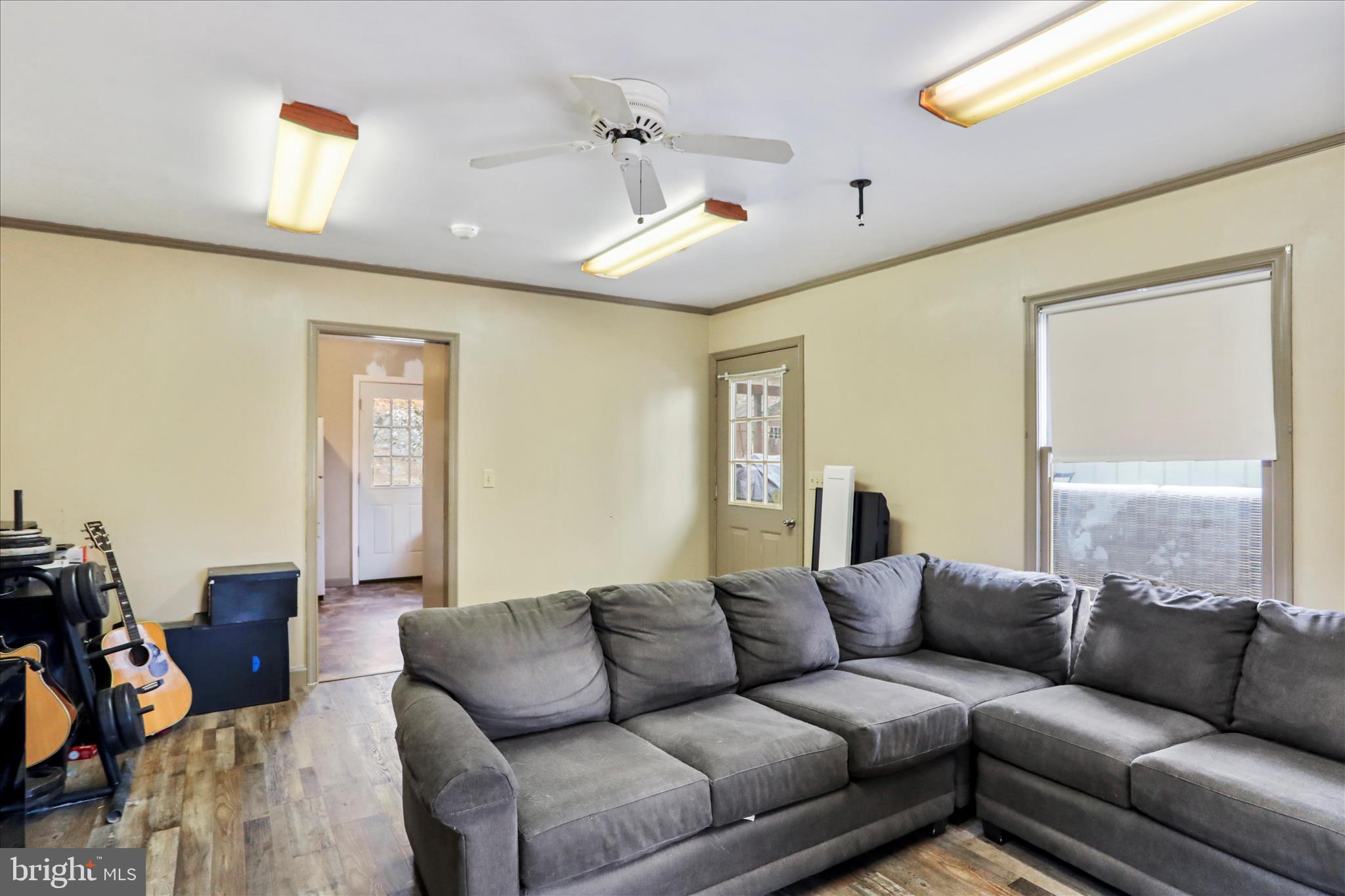 7879 Talhelm Road Chambersburg, PA 17202 - Photo 32 of 43 a living room with furniture and a large window