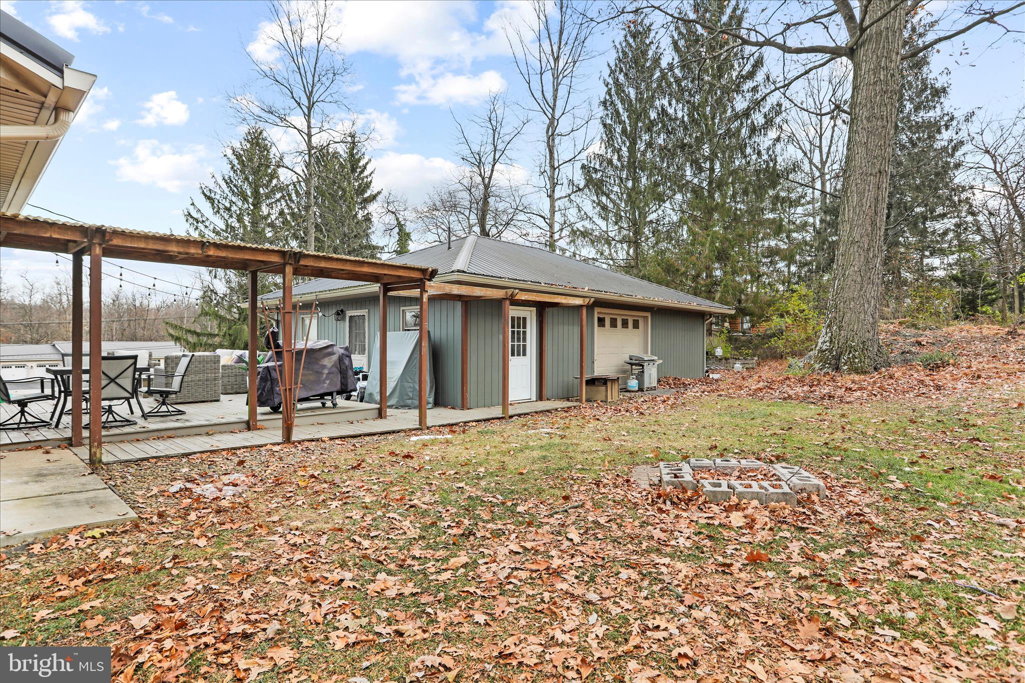 7879 Talhelm Road Chambersburg, PA 17202 - Photo 40 of 43 a view of a house with yard and sitting area
