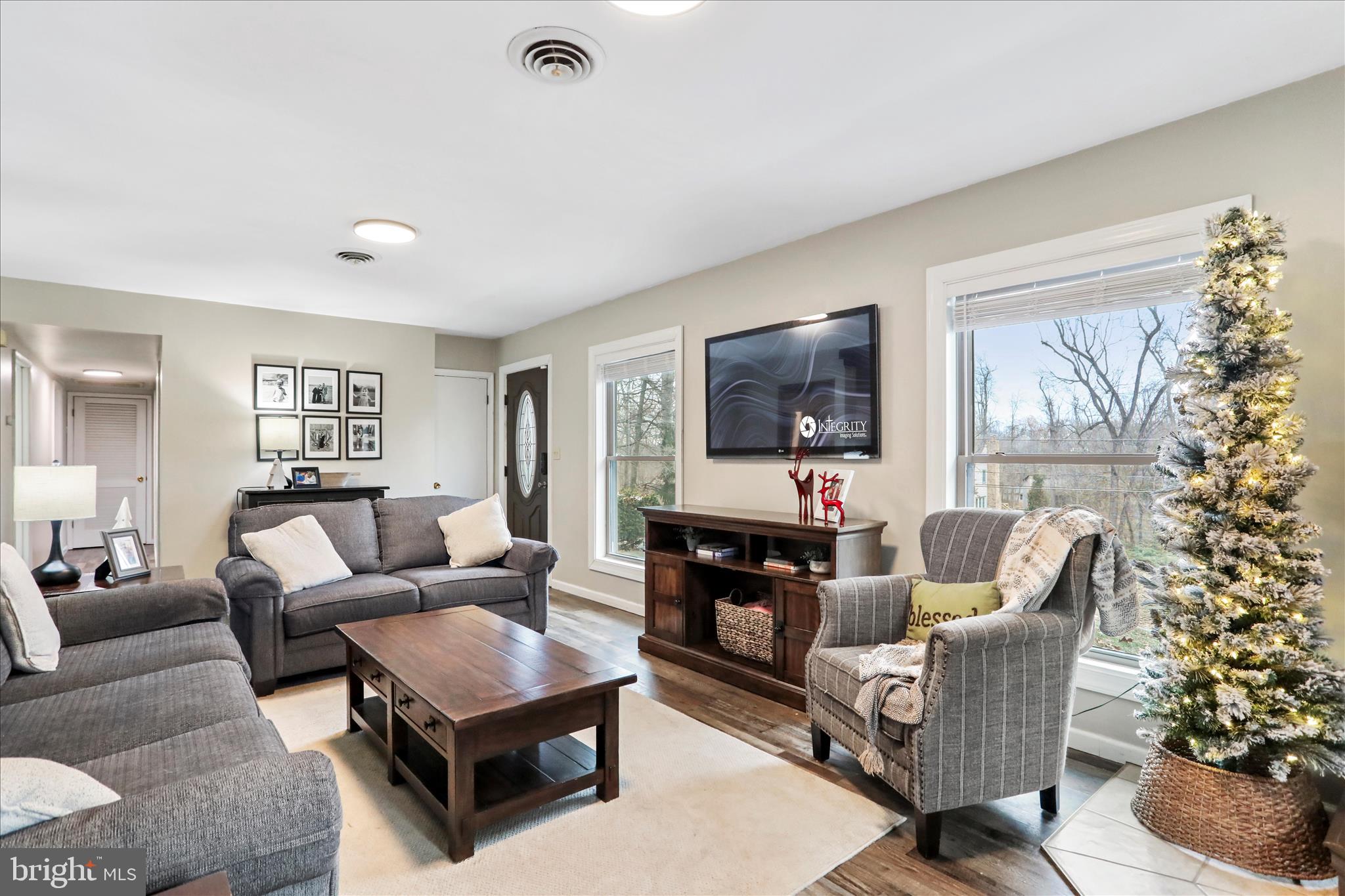 7879 Talhelm Road Chambersburg, PA 17202 - Photo 5 of 43 a living room with furniture and a flat screen tv