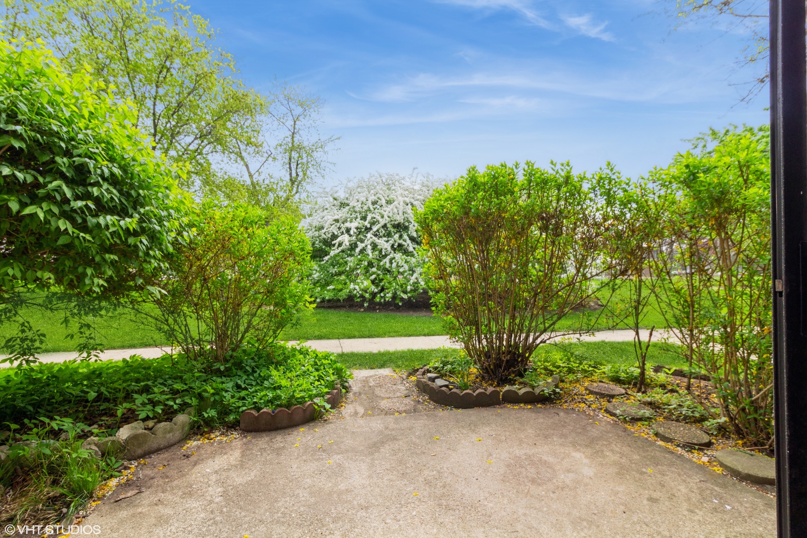 118 East Bailey Road, Unit D Naperville, IL 60565 - Photo 12 of 15 a view of a garden with plants and large trees