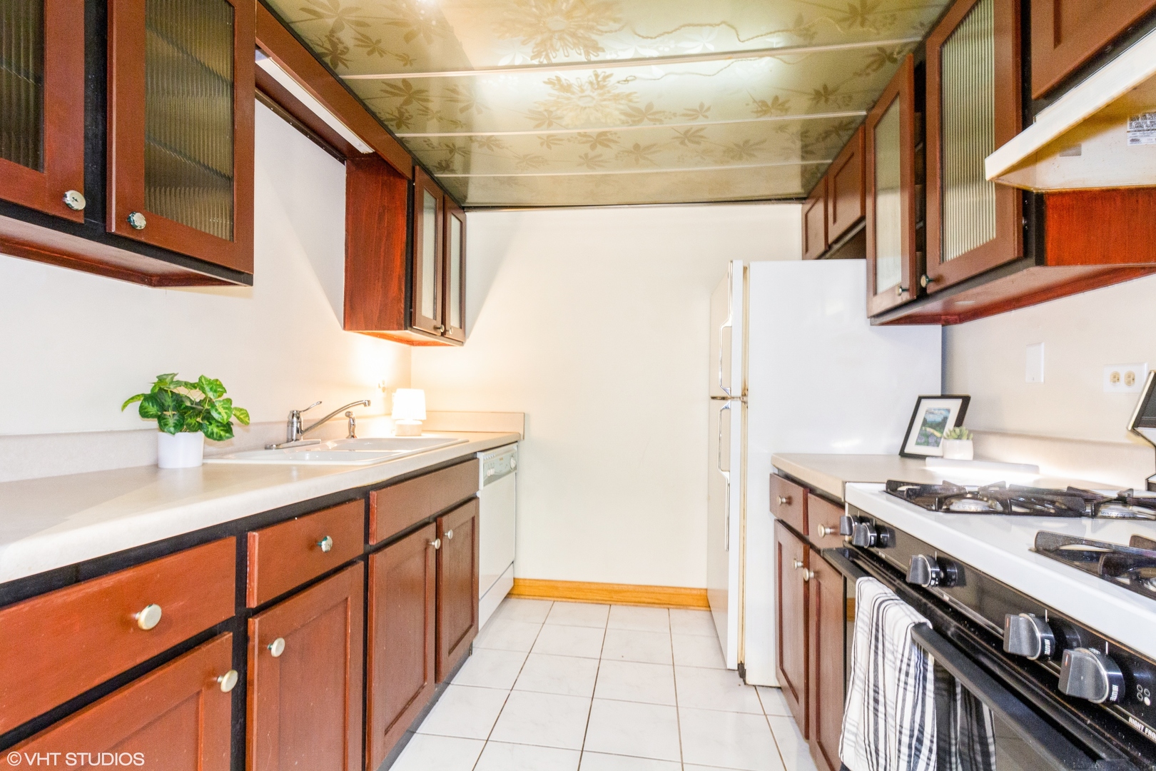118 East Bailey Road, Unit D Naperville, IL 60565 - Photo 7 of 15 a kitchen with stainless steel appliances granite countertop a sink and a stove