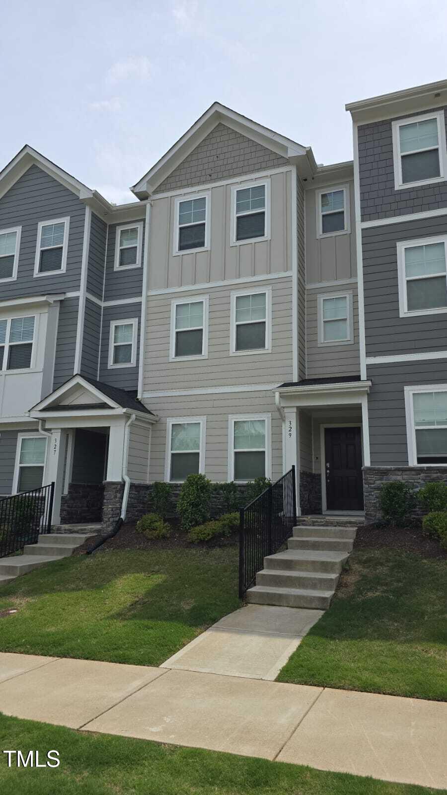 Undisclosed Address Wake Forest, NC 27587 - Photo 2 of 15 a front view of a house with a garden