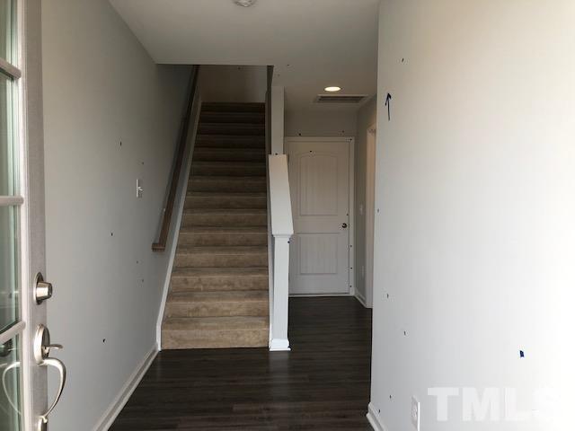 Undisclosed Address Wake Forest, NC 27587 - Photo 4 of 15 a view of entryway and gallery with wooden floor