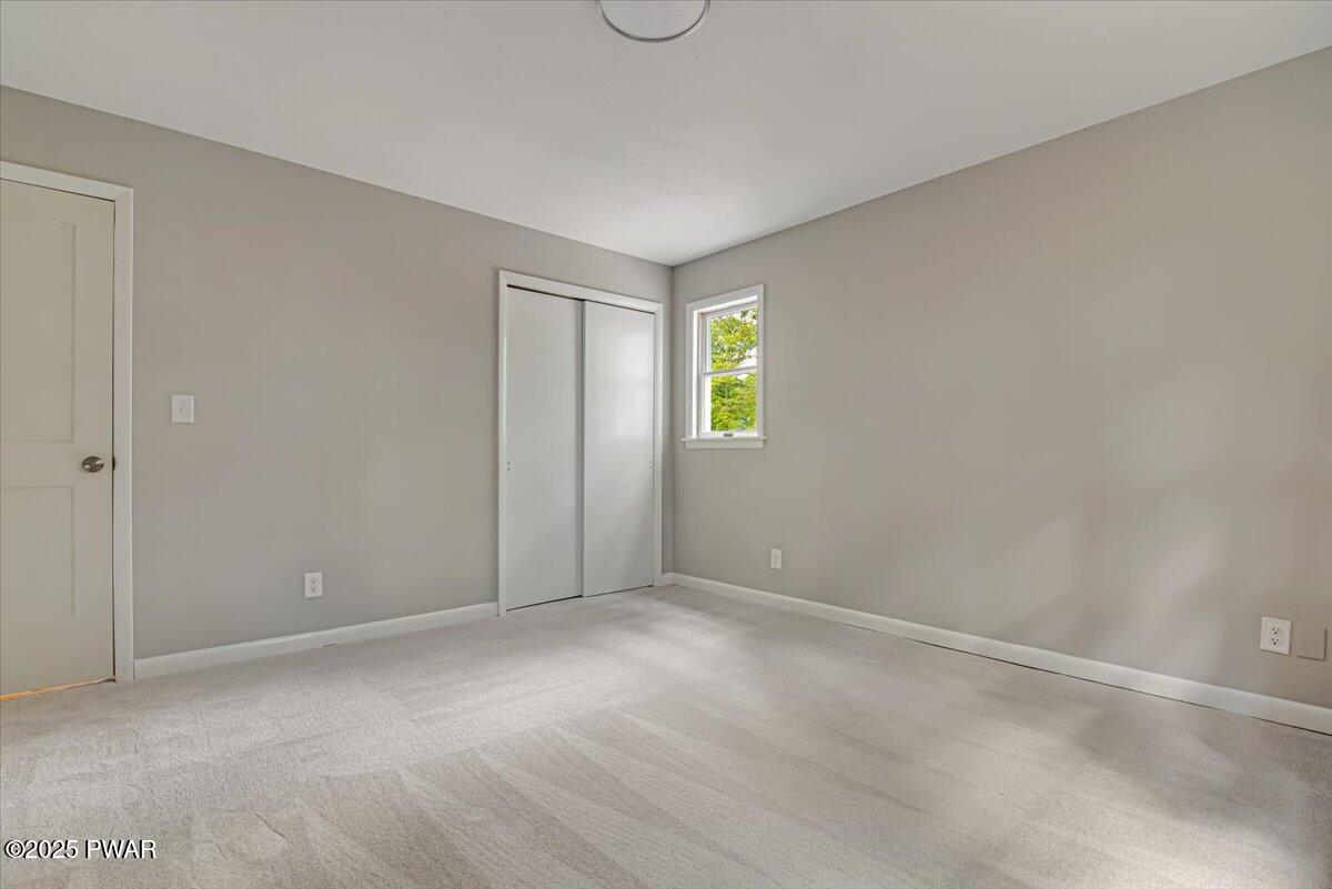 107 Kiel Road Milford, PA 18337 - Photo 34 of 71 a view of an empty room with a window