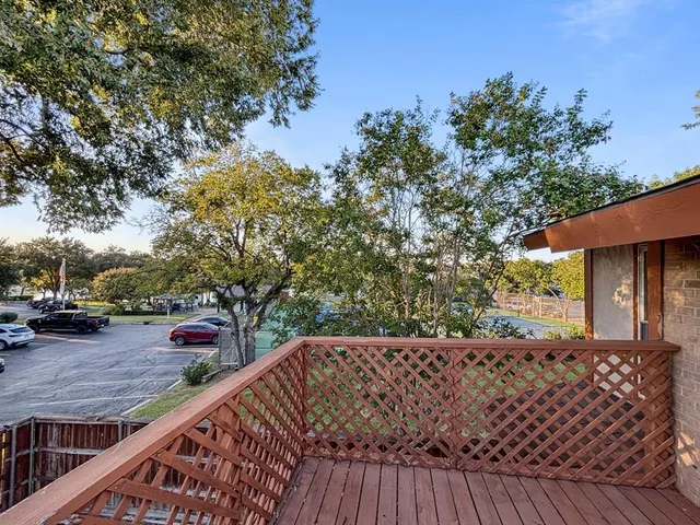 a bathroom with a double vanity sink a toilet and shower