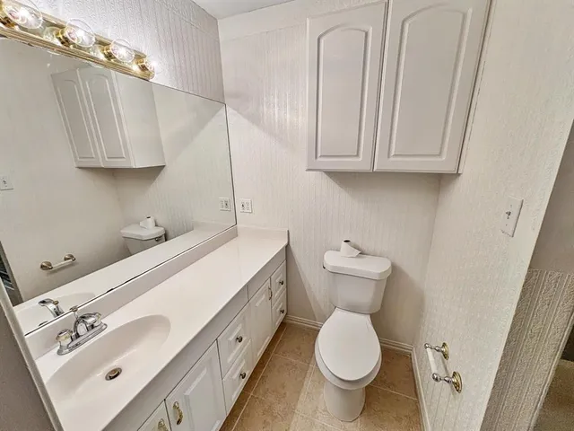 a bathroom with a shower and a toilet