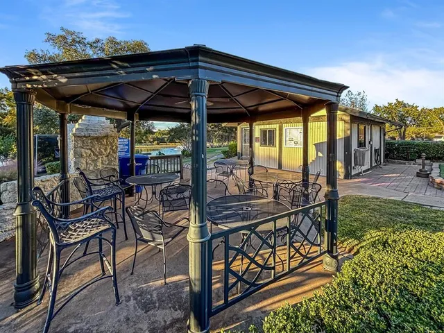 a view of a park with large trees