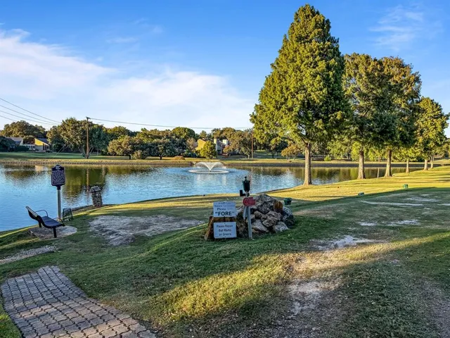 a view of a yard with swimming pool