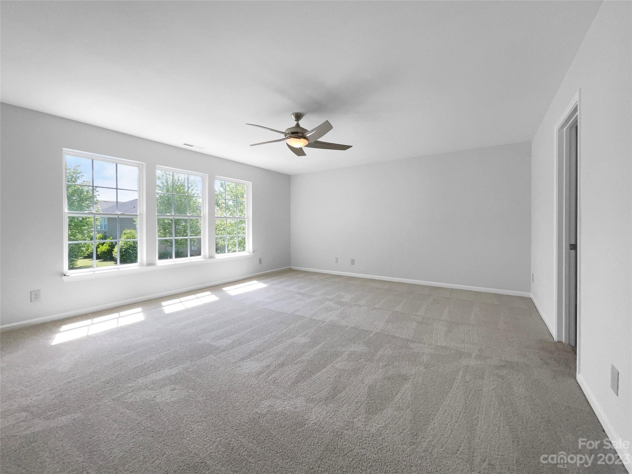 2098 Durand Road Fort Mill, SC 29715 - Photo 17 of 21 a view of a livingroom with a ceiling fan and window