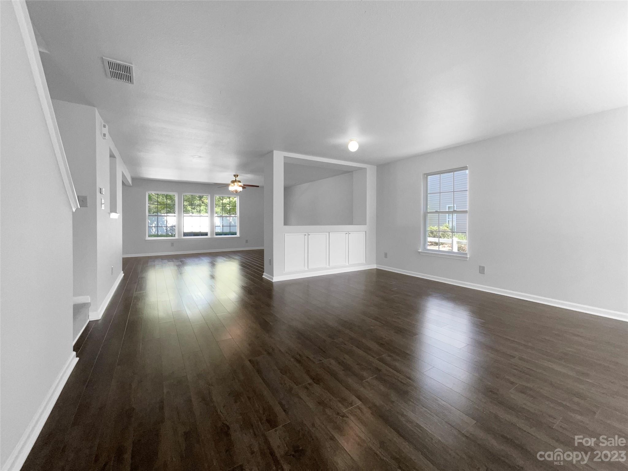 2098 Durand Road Fort Mill, SC 29715 - Photo 3 of 21 an empty room with wooden floor and windows