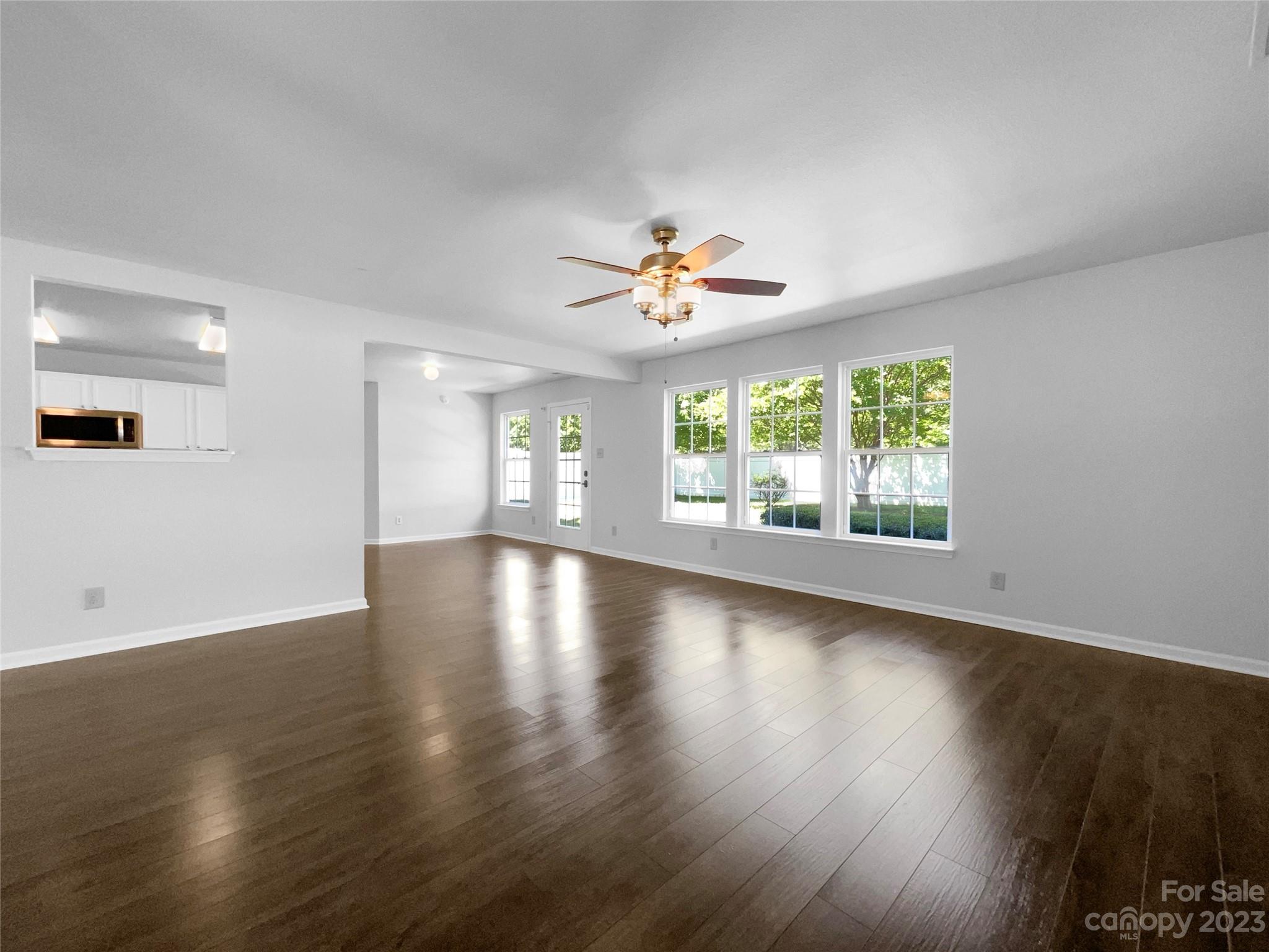 2098 Durand Road Fort Mill, SC 29715 - Photo 8 of 21 a view of an empty room with wooden floor and a window