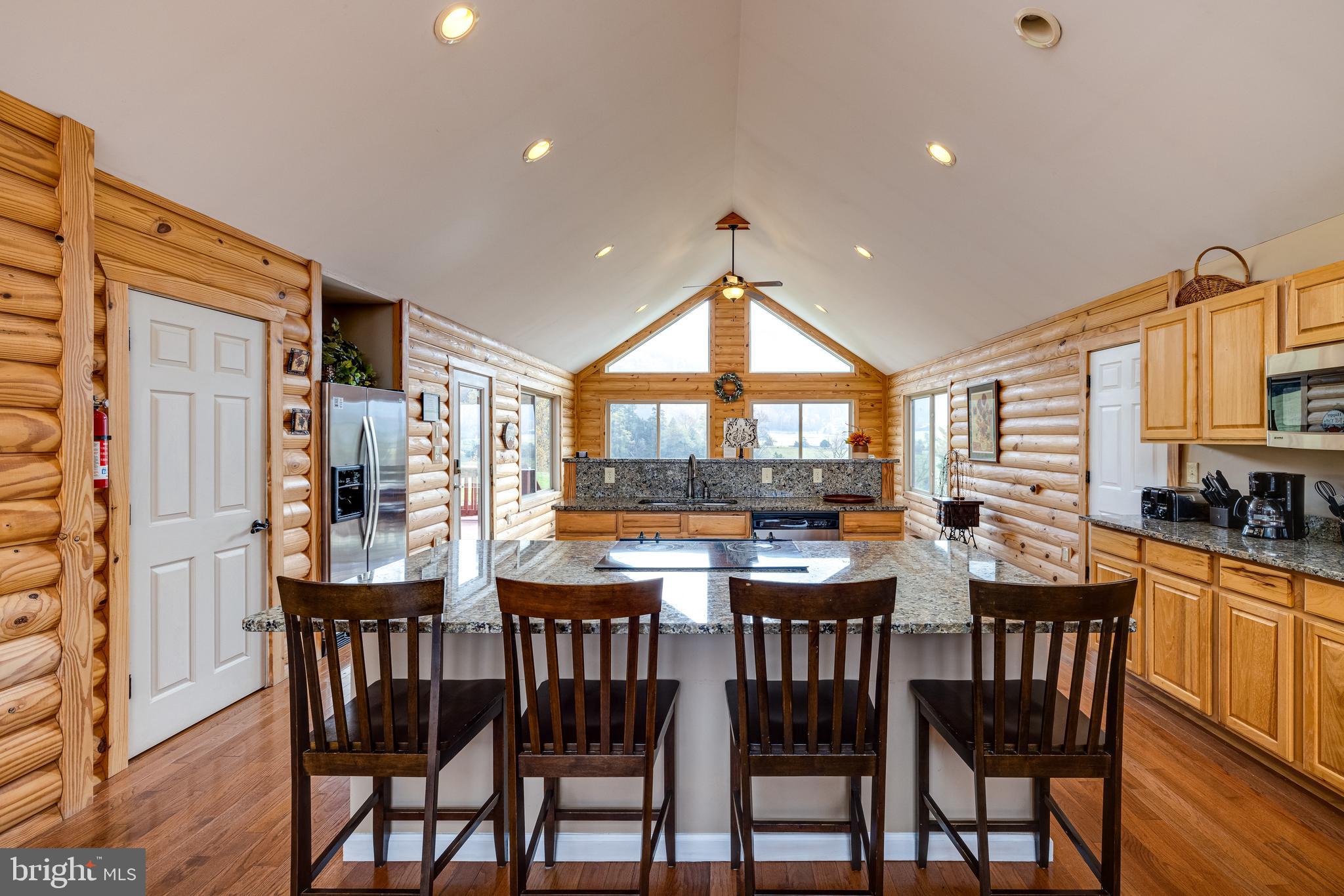 2225 Valley Burg Road Luray, VA 22835 - Photo 13 of 74 a dining room with stainless steel appliances a table and chairs
