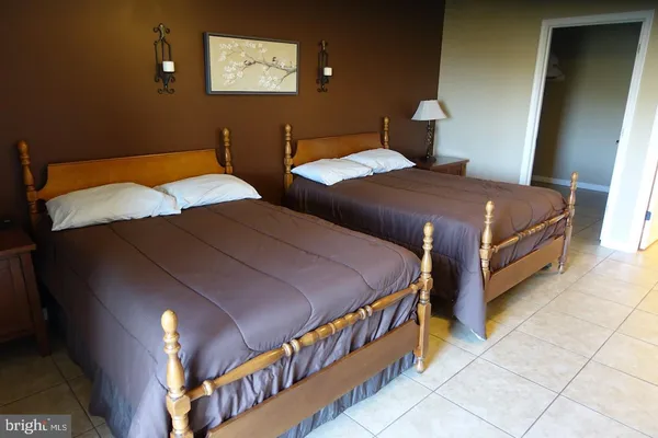a dining room with furniture window and wooden floor