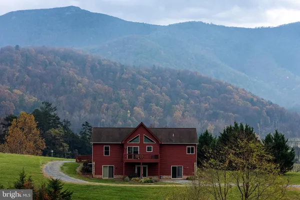 a view of a house with a big yard