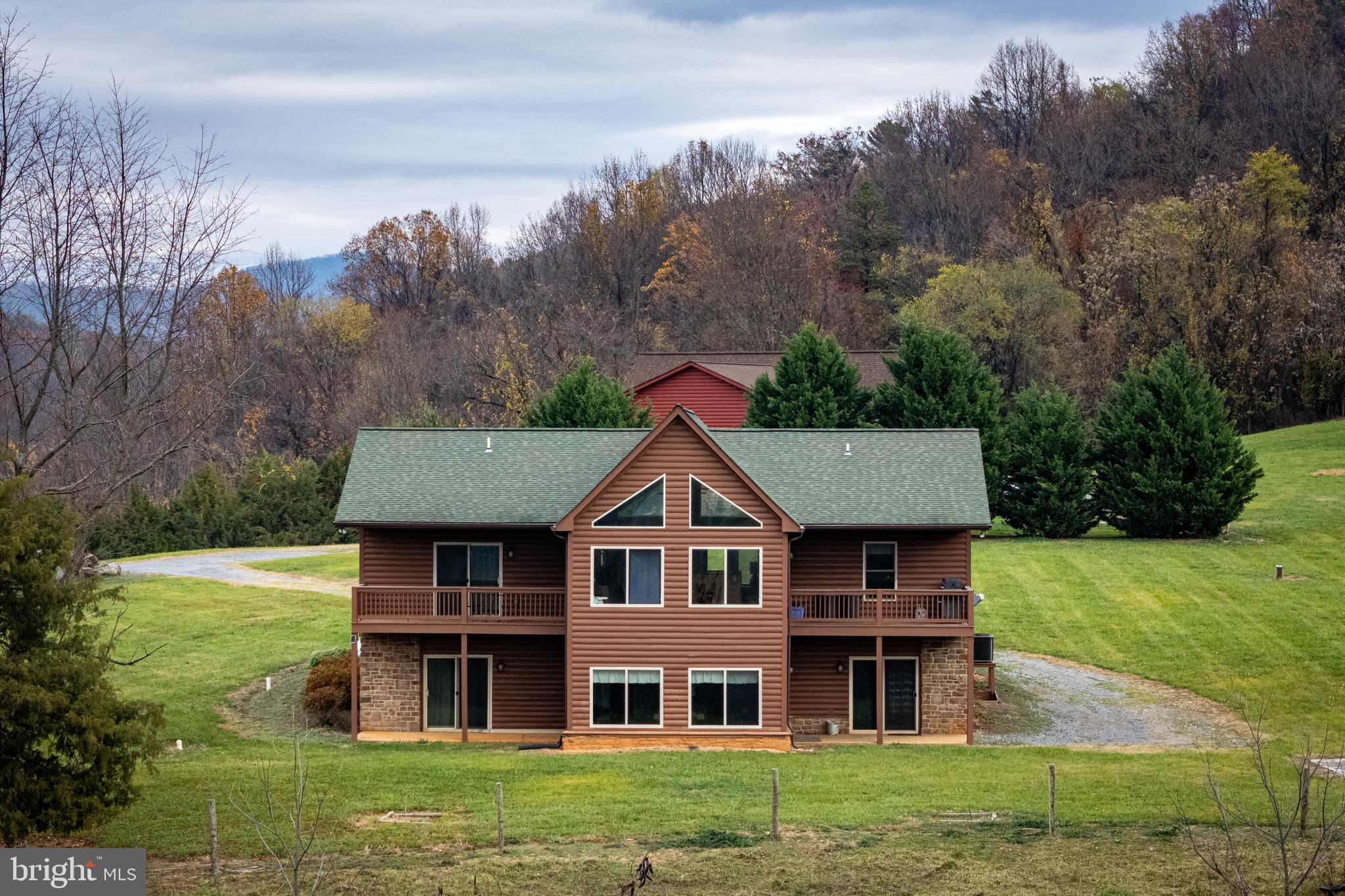 2225 Valley Burg Road Luray, VA 22835 - Photo 41 of 74 a aerial view of a house next to a big yard and large trees