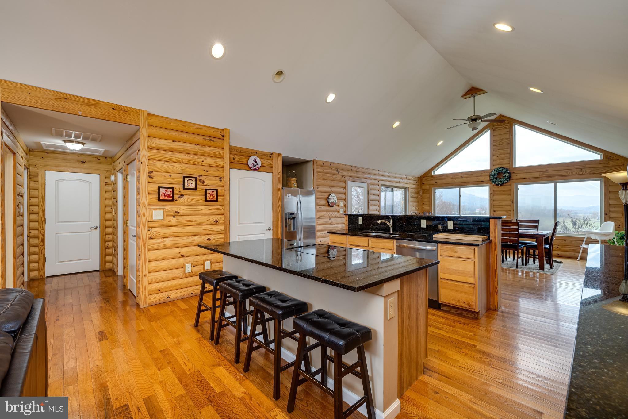 2225 Valley Burg Road Luray, VA 22835 - Photo 47 of 74 an open kitchen with a table and chairs in it
