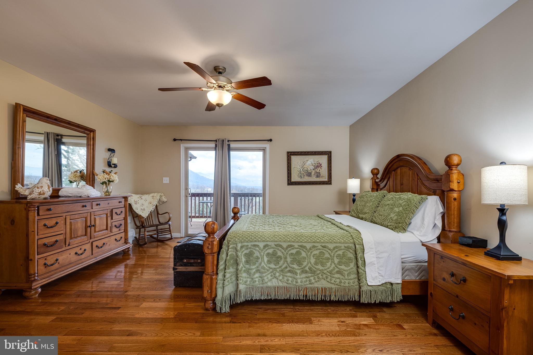2225 Valley Burg Road Luray, VA 22835 - Photo 50 of 74 a bedroom with a bed and dresser with mirror